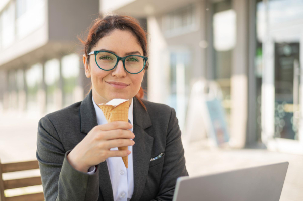 woman celebrating home business success with a well deserved ice cream treat